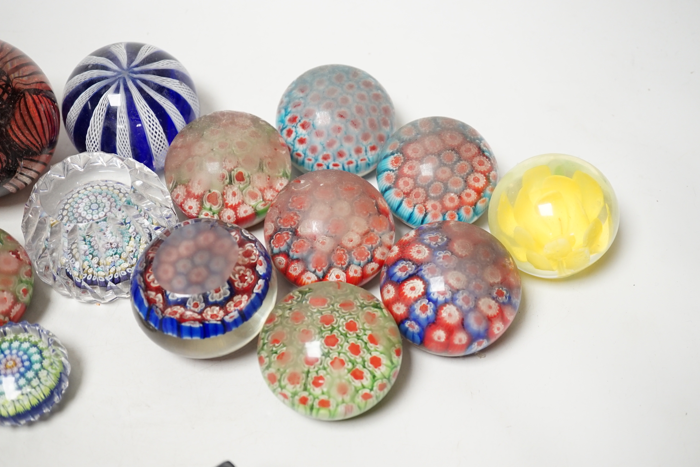 A group of assorted glass paperweights, including a Perthshire type close-packed millefiori paperweight
